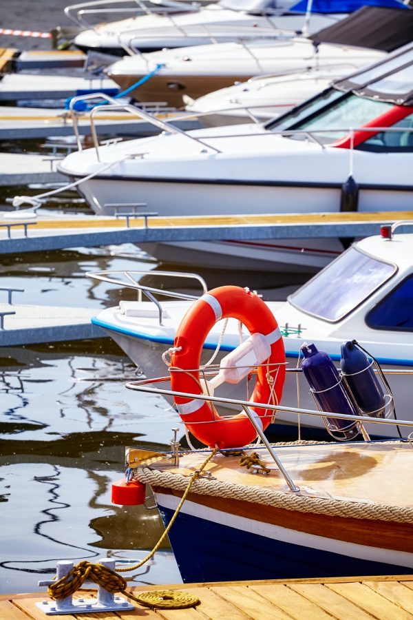 Marina with moored yachts and motorboats.